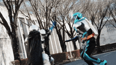 a man in a superhero costume is fighting another man