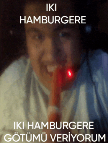 a man eating a hamburger with the words iki hamburgere iki hamburgere gotumu veriyorum on the bottom