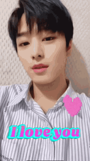 a young man in a striped shirt with the words i love you on the bottom