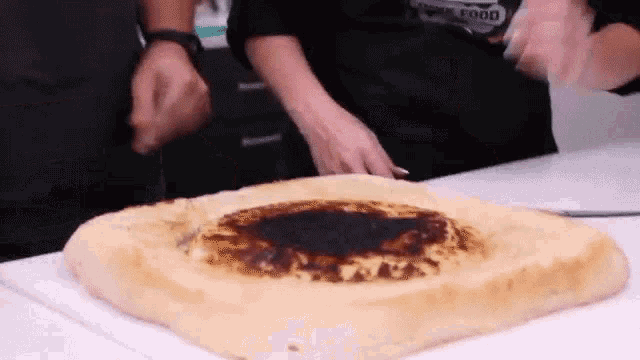 Cutting Bread In The Middle Cutting GIF - Cutting Bread In The Middle Cutting Giant Bread GIFs