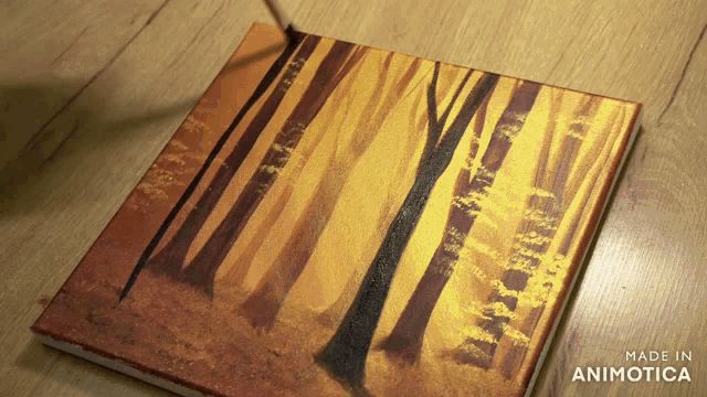 a painting of trees on a wooden surface that says made in animotica