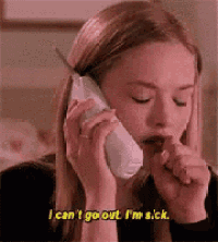 a woman is coughing while talking on a cell phone and saying i can 't go out