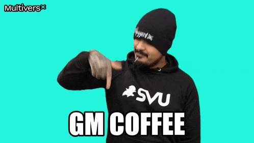 a man wearing a black hoodie that says gm coffee on it