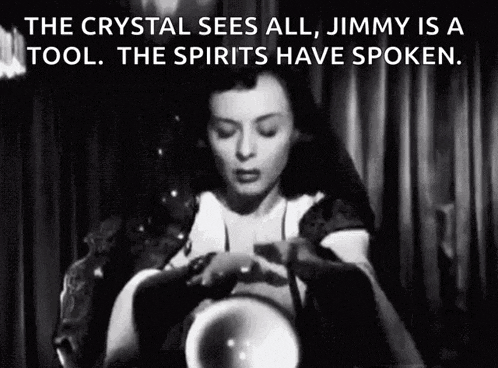 a black and white photo of a woman holding a crystal ball