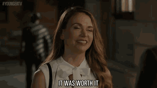 a woman is smiling and saying it was worth it ..