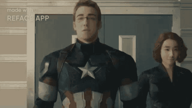 a man in a captain america costume stands next to a woman in a black widow costume