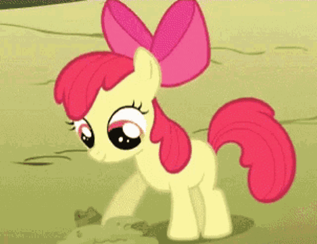 a pony with a pink bow on its head