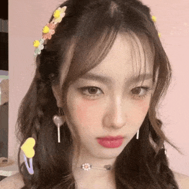 a close up of a woman 's face with a choker and hair clips