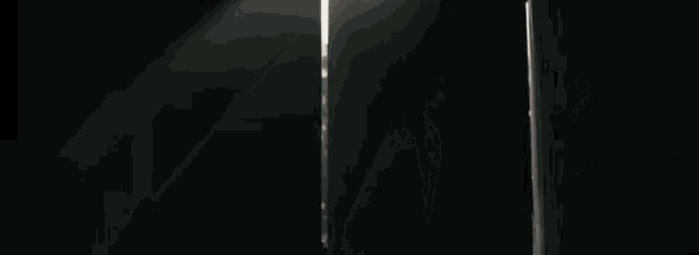 the sun is shining through the open door in the dark .
