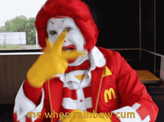 a mcdonald 's clown is making a funny face and says " me when rainbow cum "