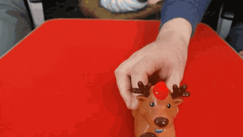 a person holding a reindeer toy with the words i 'm a reliable reindeer