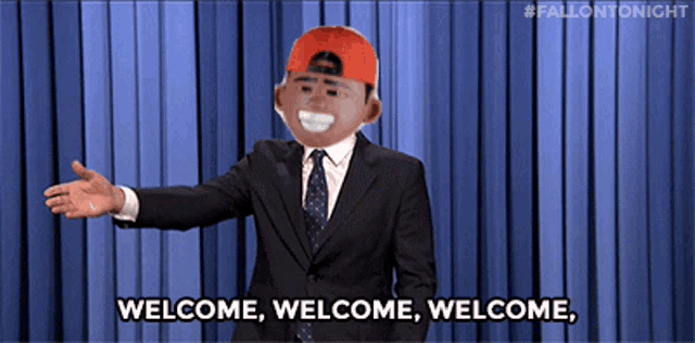 a man in a suit and tie is saying welcome welcome welcome