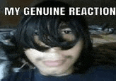 a close up of a person 's face with a caption that reads `` my genuine reaction '' .