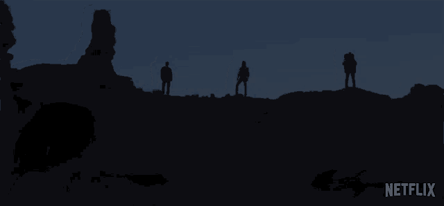 a netflix advertisement shows a group of people standing on top of a hill