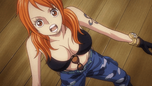 a woman in a black top and blue pants has a tattoo on her arm