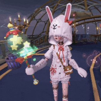 a girl in a bunny costume is holding a stick