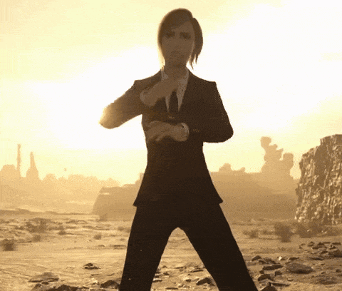 a man in a suit and tie is standing in a desert