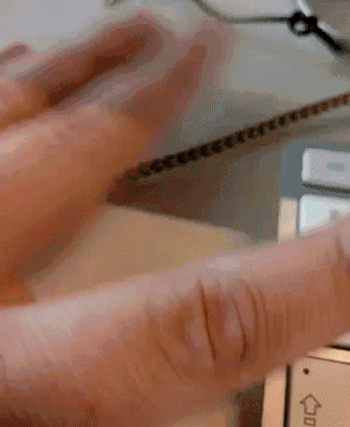 a close up of a person 's fingers pressing a button on a keyboard .