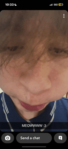 a close up of a person 's face with a message that says meowwww.3