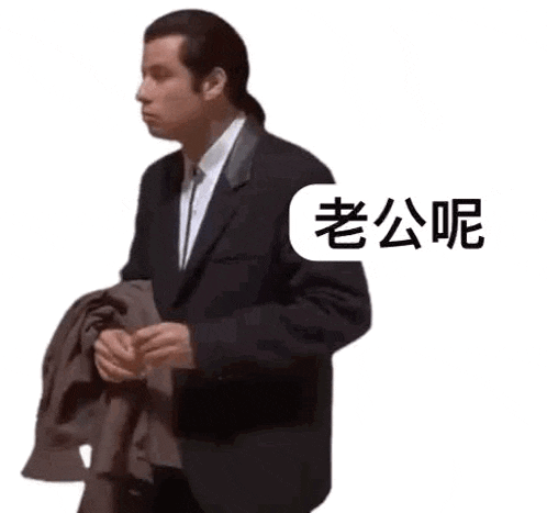 a man in a suit and tie is holding a jacket and talking in chinese .