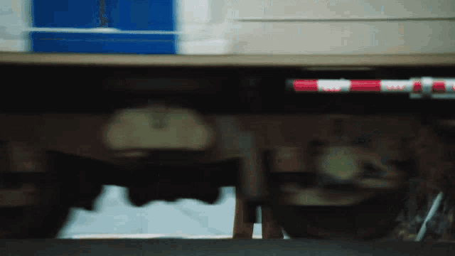 a blurred image of a vehicle with a red and white stripe on the side that says ' rv '