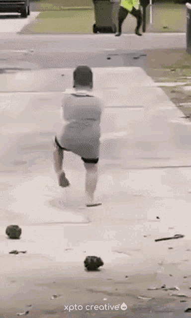 a man with a prosthetic leg is running down a sidewalk