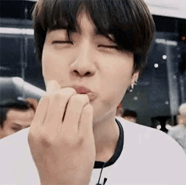 a close up of a person eating a piece of food .