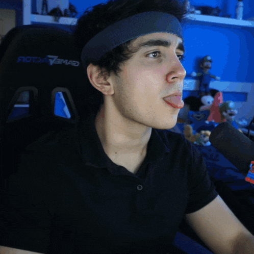 a young man wearing a headband that says ' rotary mad ' on it