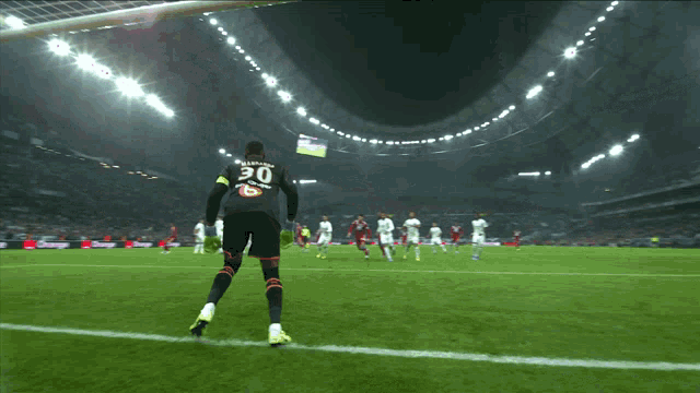 soccer players on a field with a goalie wearing number 10