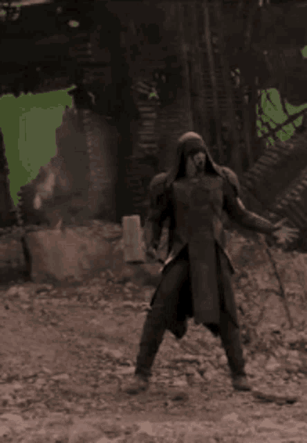 a man is standing in the dirt with a green screen behind him that says chris dance-off bro