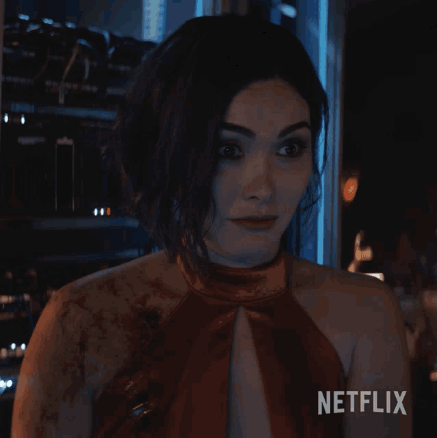 a woman in a red dress with the words what netflix on the bottom