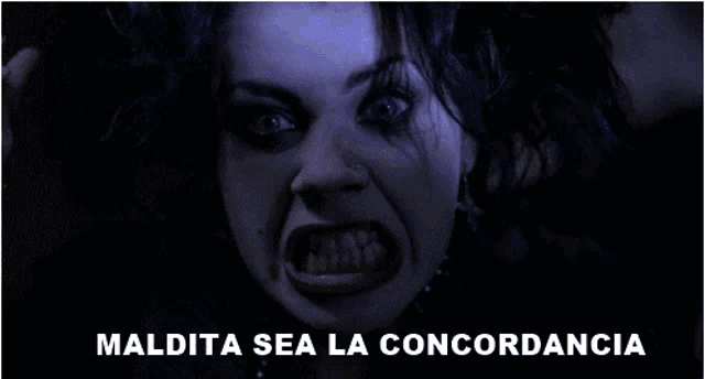 a woman with her mouth wide open and the words maldita sea la concordancia behind her