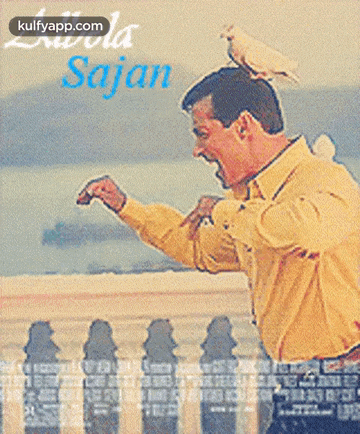 a man reaches out to touch a woman 's hand on a poster for the movie sajan