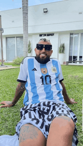 a man with a beard wearing a soccer jersey with the number 10 on it