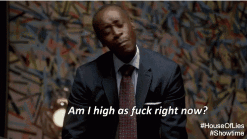 a man in a suit and tie is asking " am i high as fuck right now "