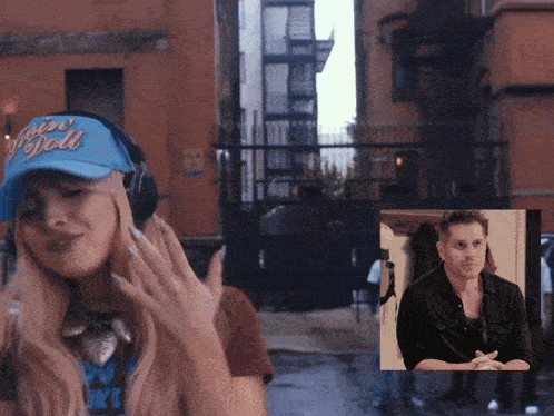 a woman wearing headphones and a hat that says ' vision doll '