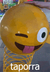 a yellow spring toy with a smiley face on it and the word taporra underneath it