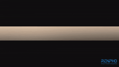 a handheld massage device sits on a table