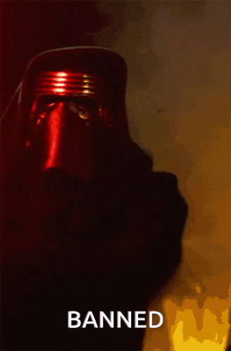 a picture of a person in a dark room with the word banned on the bottom