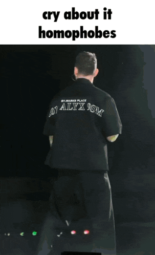 a man wearing a black jacket with the year 1917 on the back