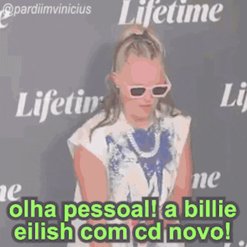 a woman wearing sunglasses is standing in front of a lifetime logo