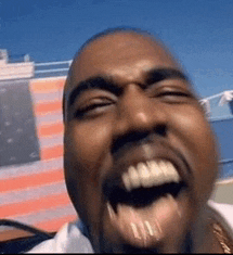 a close up of a man 's face with his mouth open and teeth showing
