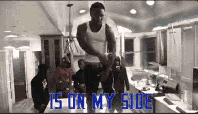 a group of men are standing in a kitchen with the words is on my side written on the bottom