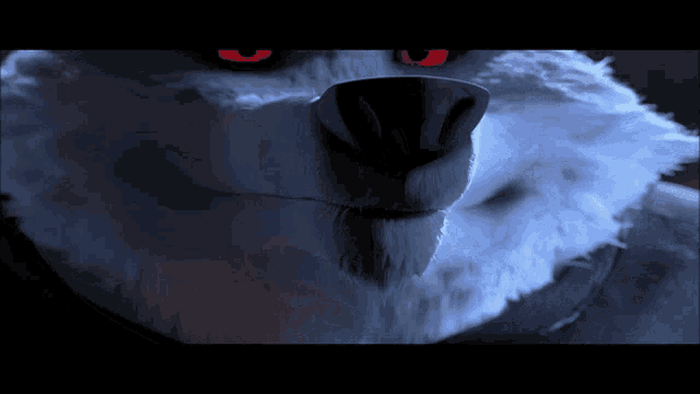 a close up of a wolf with red eyes