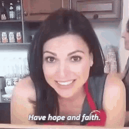 a woman is smiling in a kitchen with the words `` have hope and faith '' written on her face .