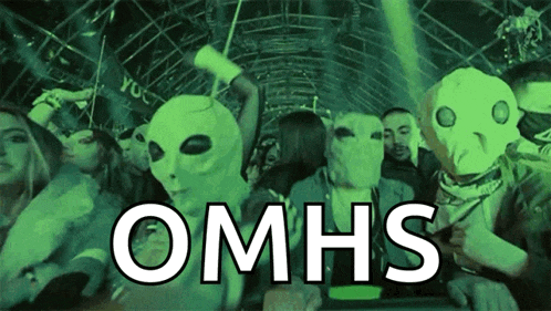 a group of people wearing alien masks with omhs written in white letters