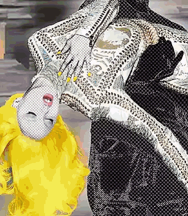 a woman with yellow hair is doing a handstand while wearing a black and white dress