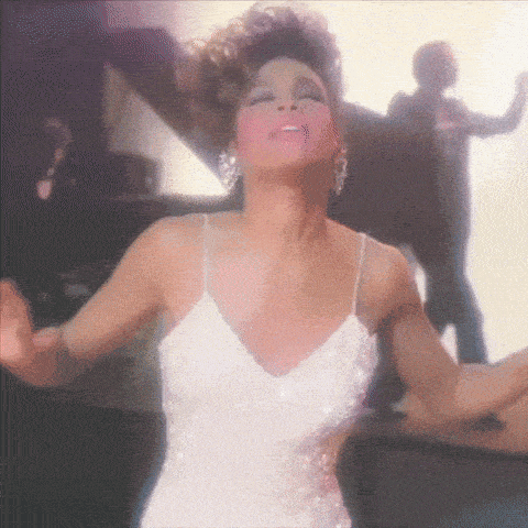 a woman in a white dress has her arms outstretched