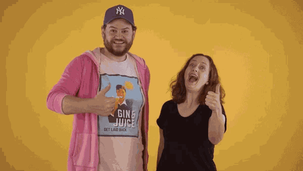a man and a woman are giving a thumbs up in front of a yellow background that says aye eee !