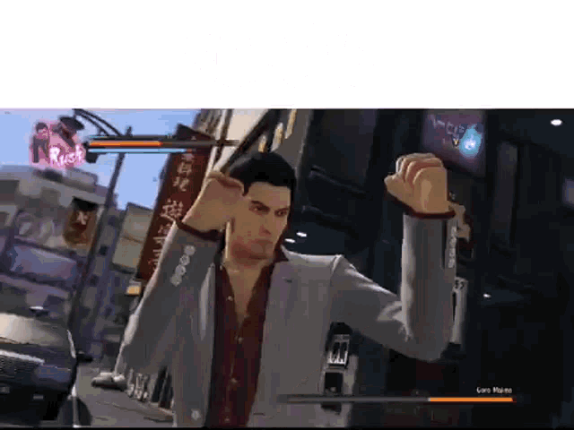 a man in a suit is playing a video game on a computer
